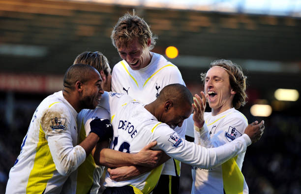 Peter Crouch, Jermain Defoe, and Luka Modric celebrating a Tottenham goal.