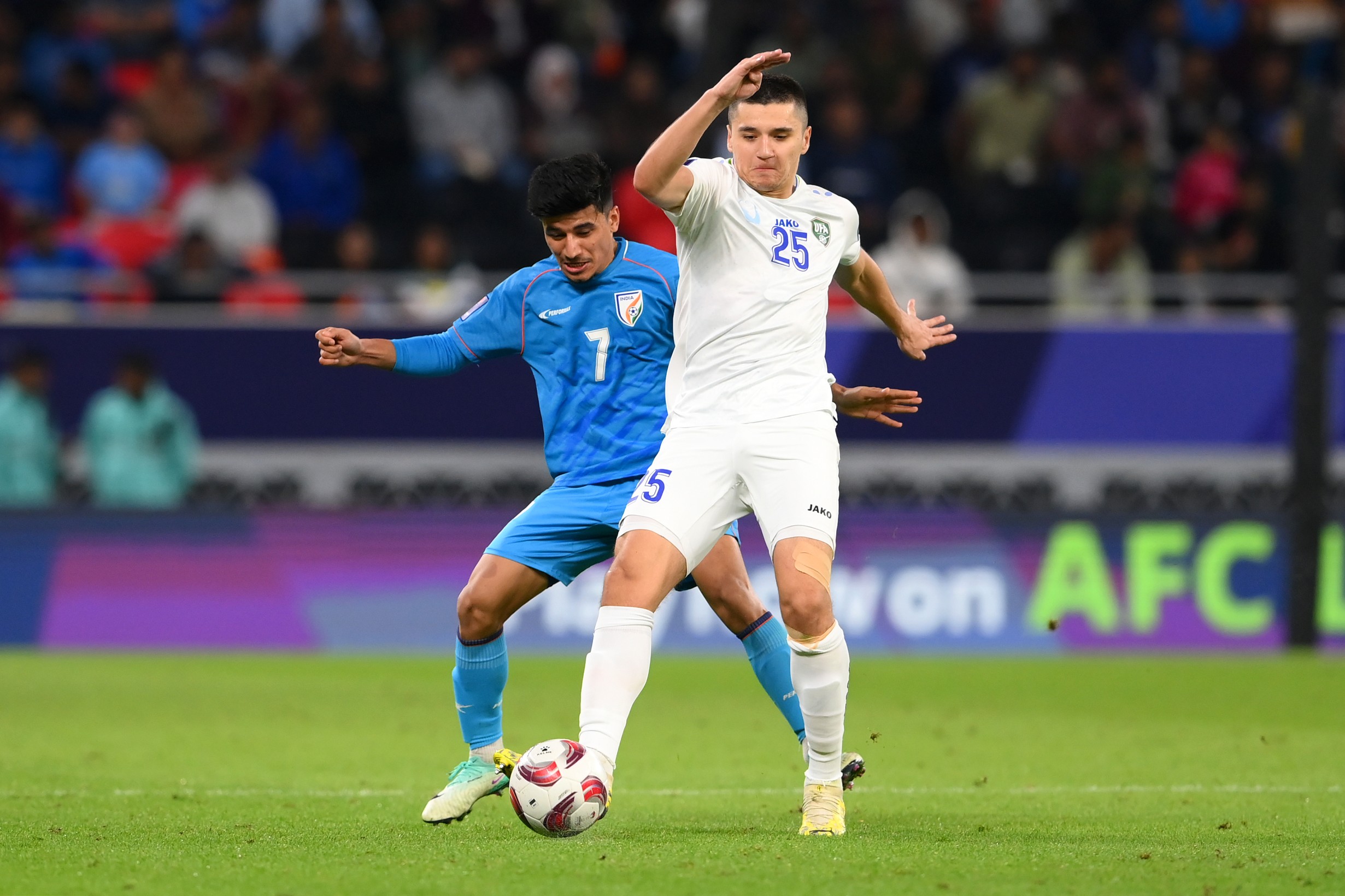 Abdukodir Khusanov in action for Uzbekistan