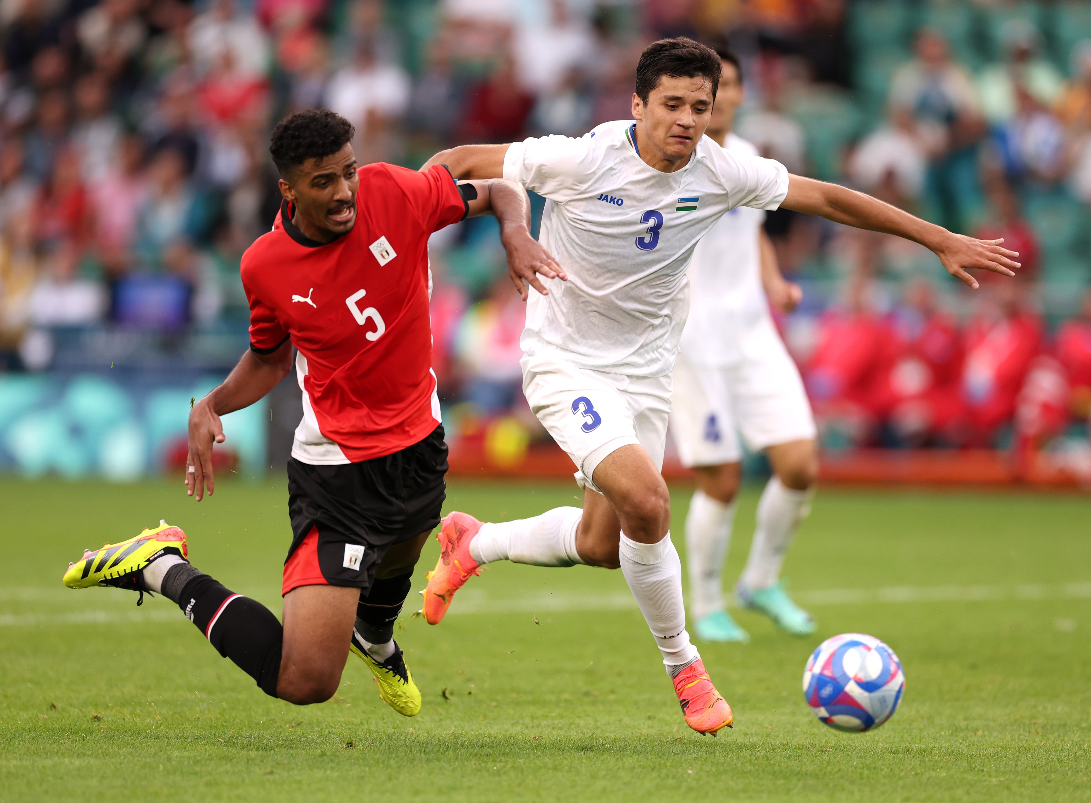 Abdukodir Khusanov in action for Uzbekistan