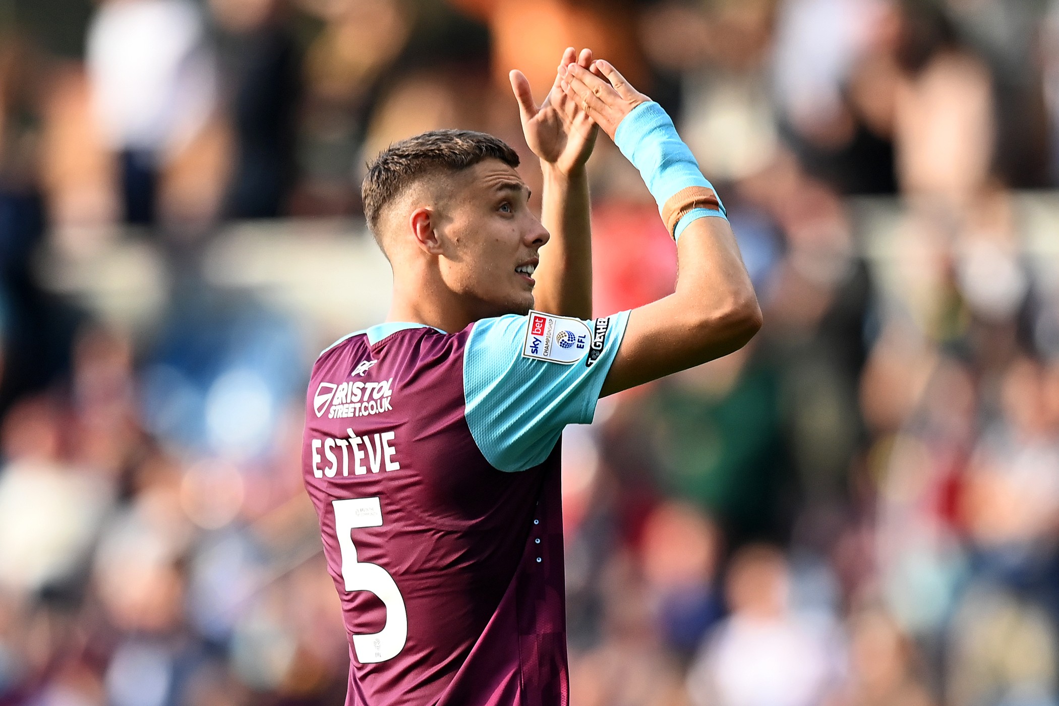 Maxime Esteve of Burnley applauds the fans