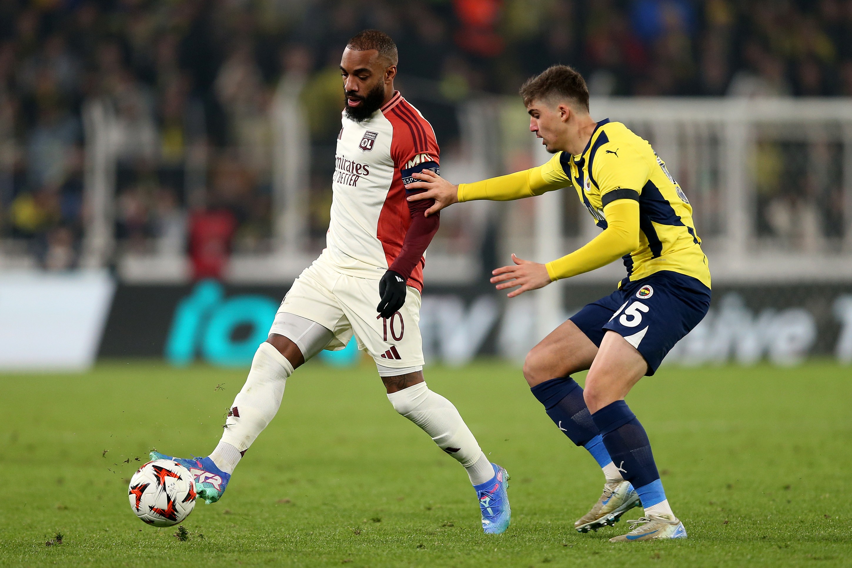 Yusuf Akcicek of Fenerbahce fights for the ball