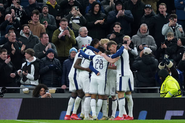Tottenham players celebrating alongside Lucas Bergvall