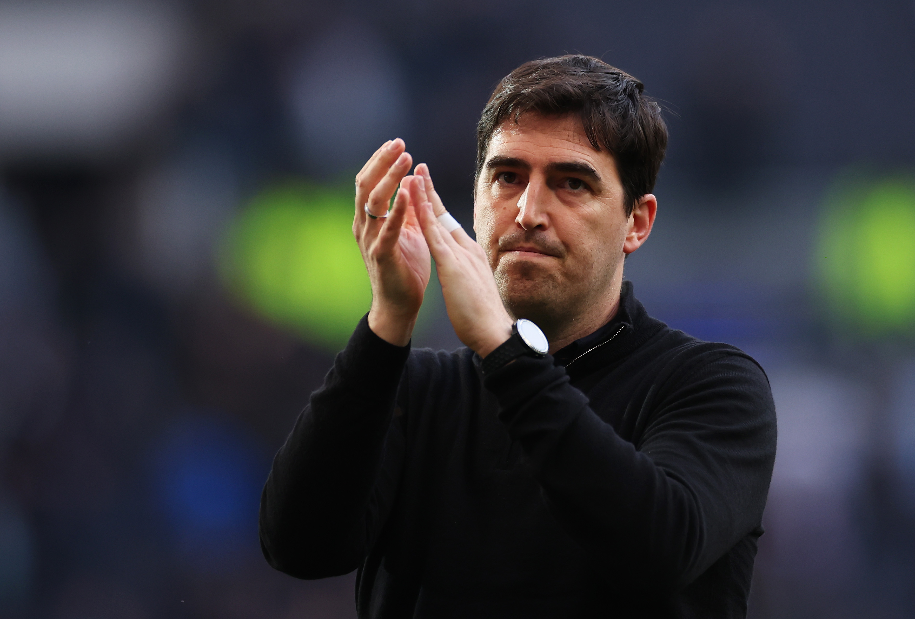 Andoni Iraola acknowledges the fans after a game