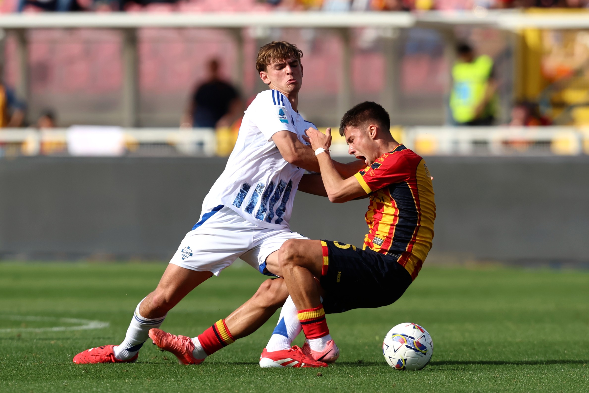 Nico Paz vies for the ball