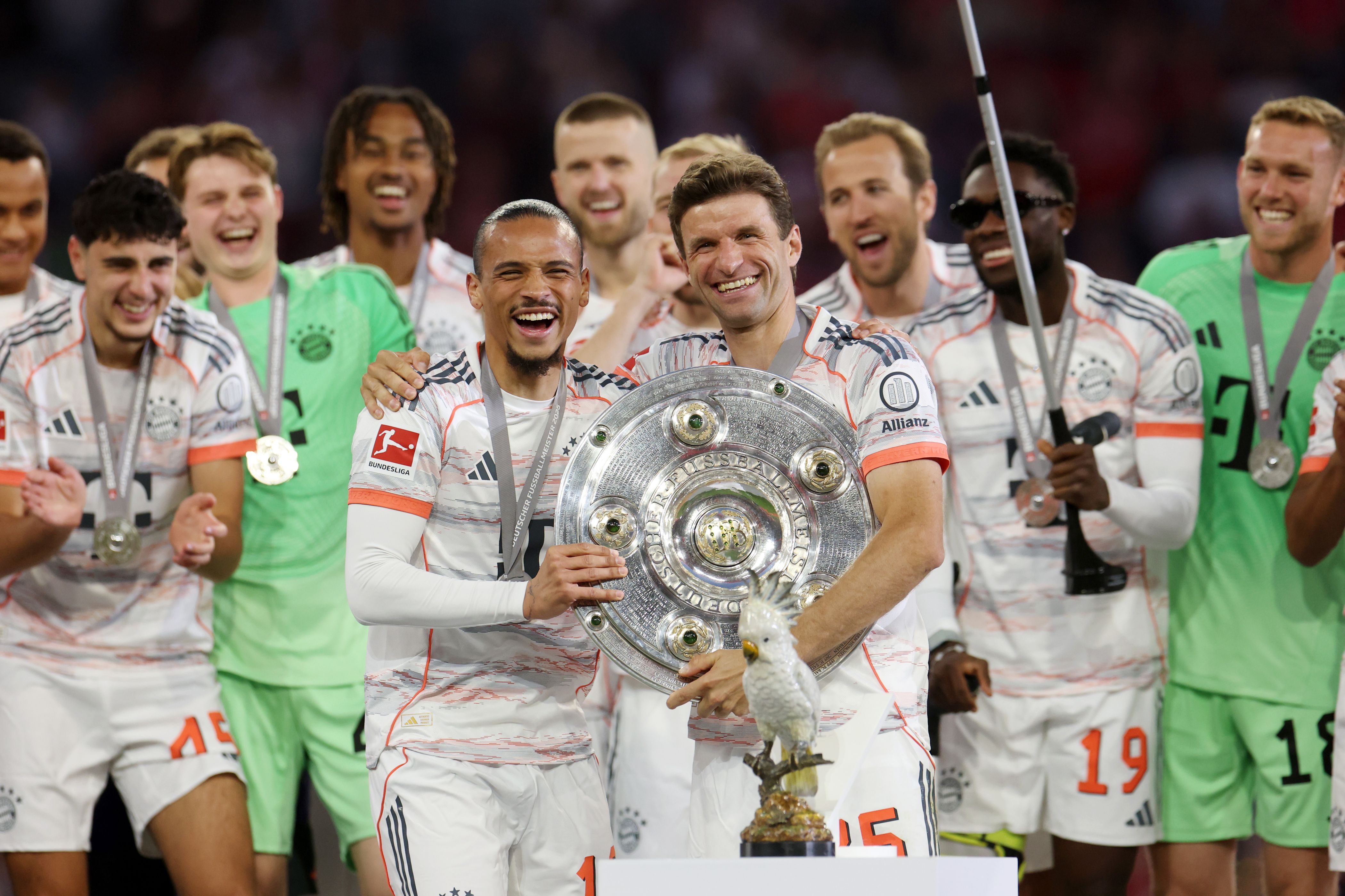 Leroy Sane of Bayern Munich celebrates with the Meisterschale trophy