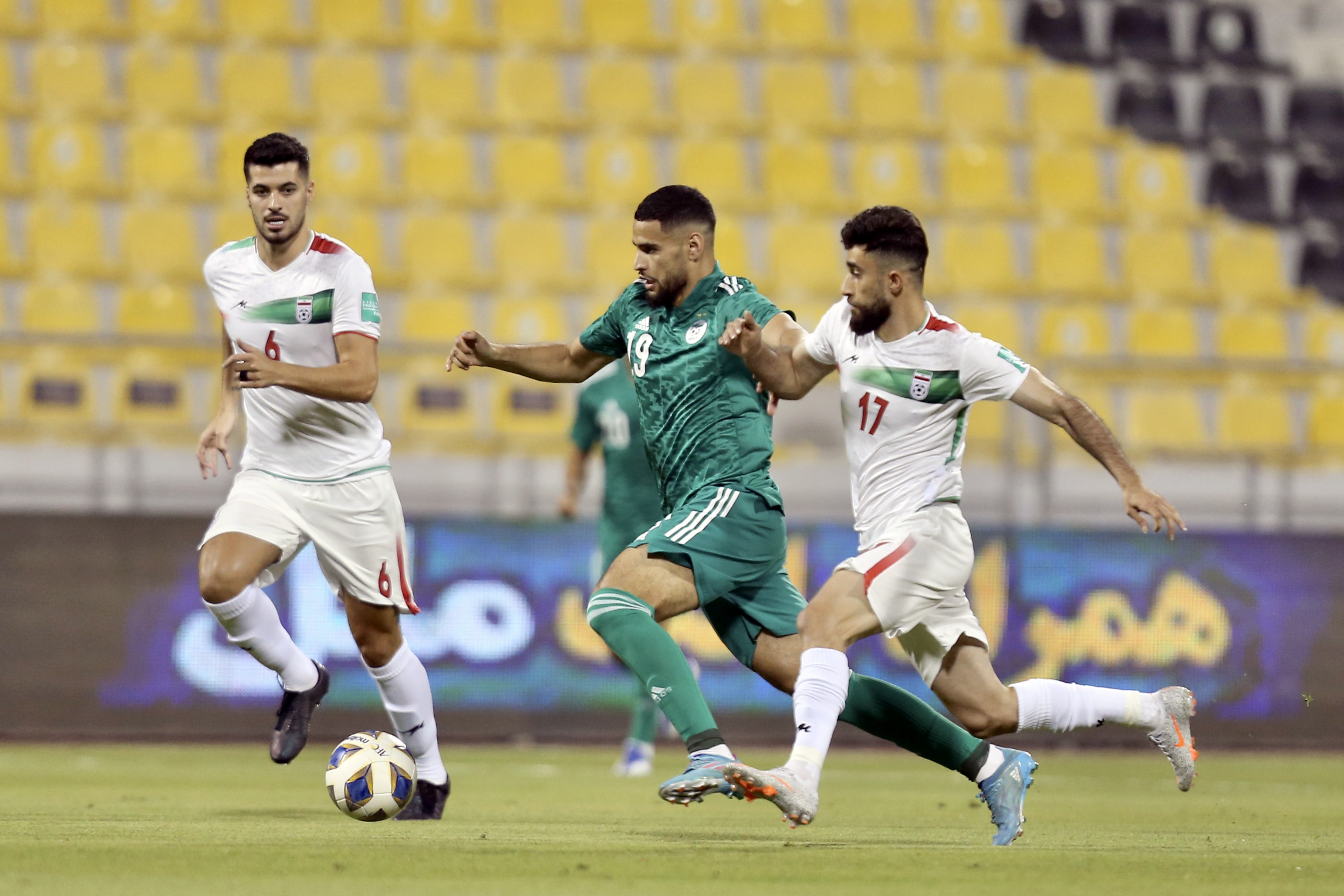 Adem Zorgane vies for the ball