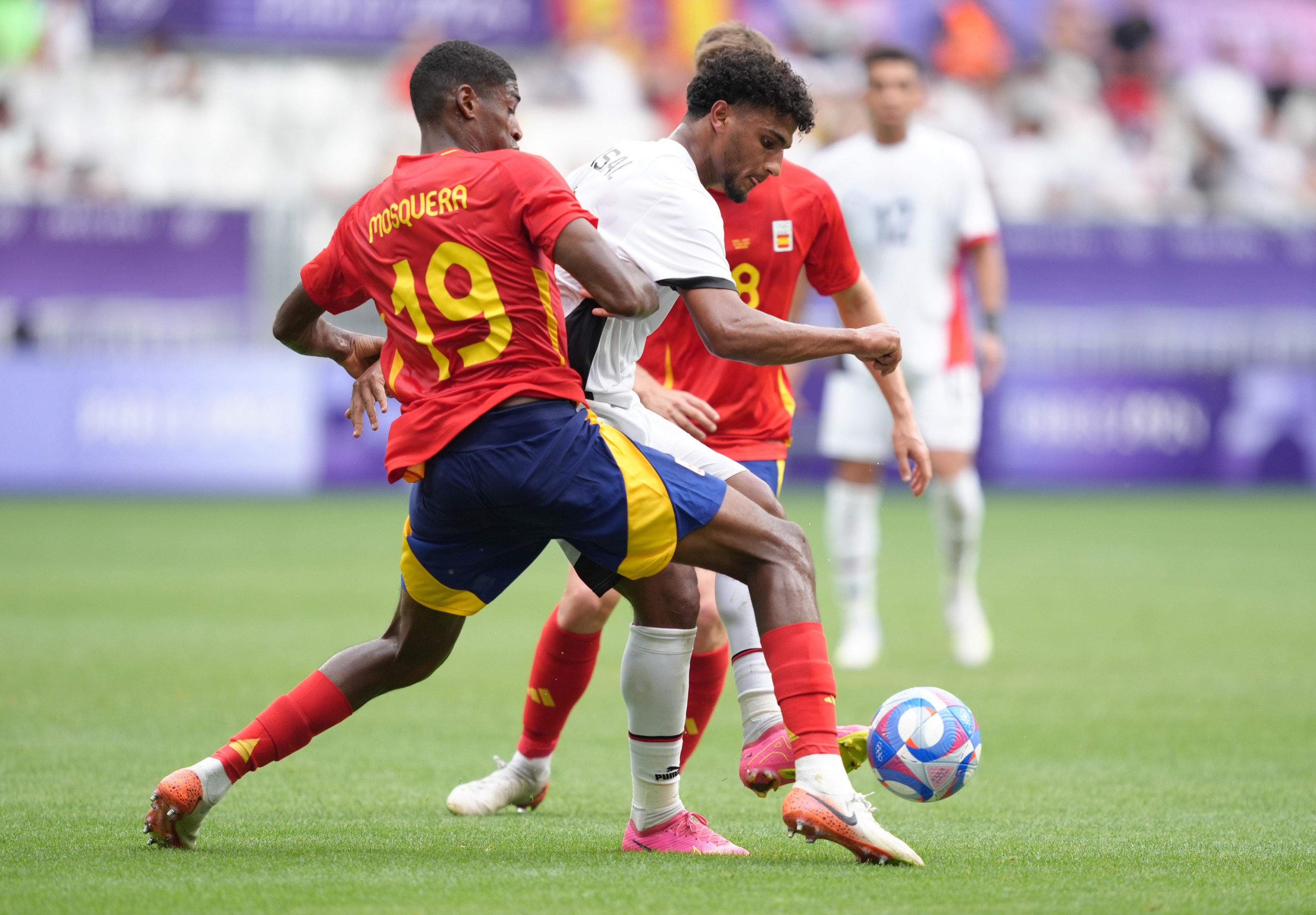 Cristhian Mosquera #19 of Team Spain challenges Osama Faisal #9 of Team Egypt