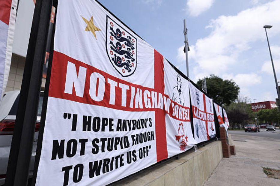 Fans of England display the national flag, which features the England emblem and reads