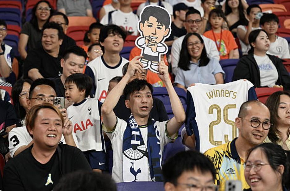 Tottenham Hotspur's fans cheer during a training session at the Kai Tak Stadium in Hong Kong on July 29, 2025, ahead of a friendly exhibition football match against Arsenal which will be played on July 31. (Photo by Peter PARKS / AFP) (Photo by PETER PARKS/AFP via Getty Images)