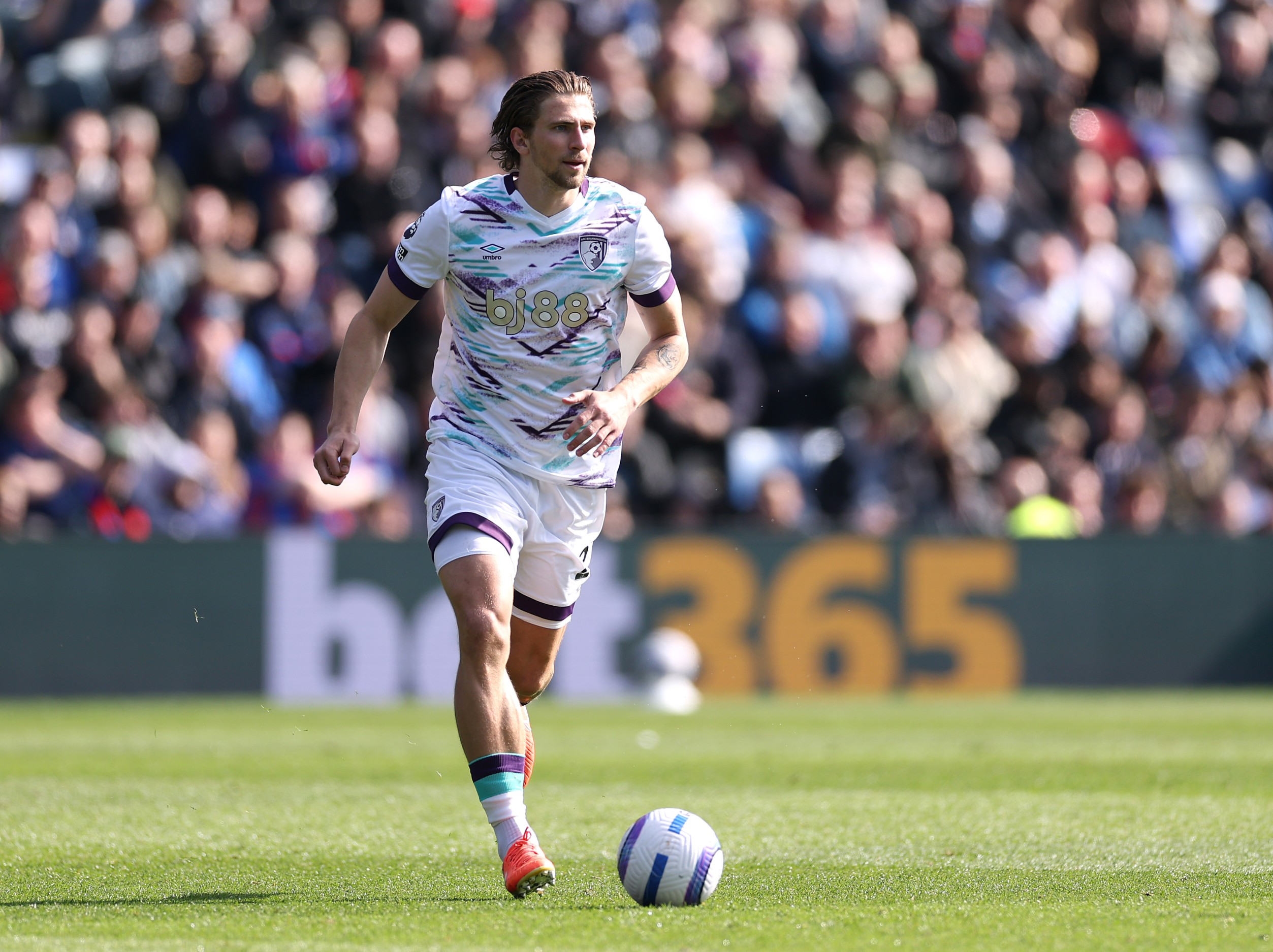 Illya Zabarnyi runs with the ball