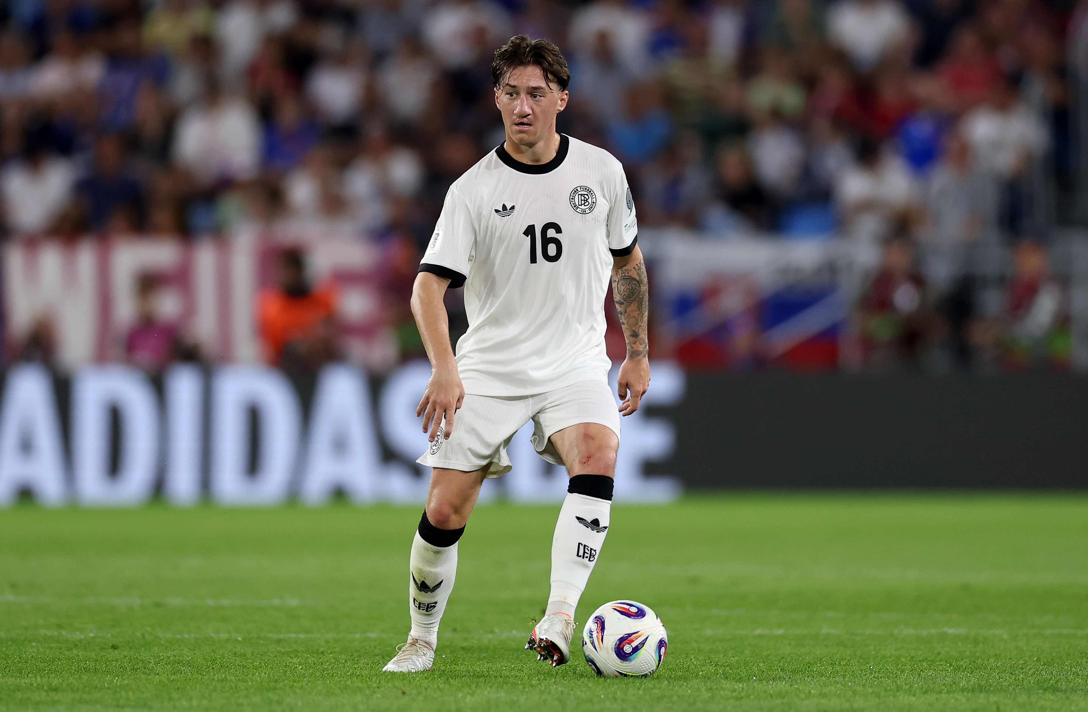 Angelo Stiller of Germany runs with the ball