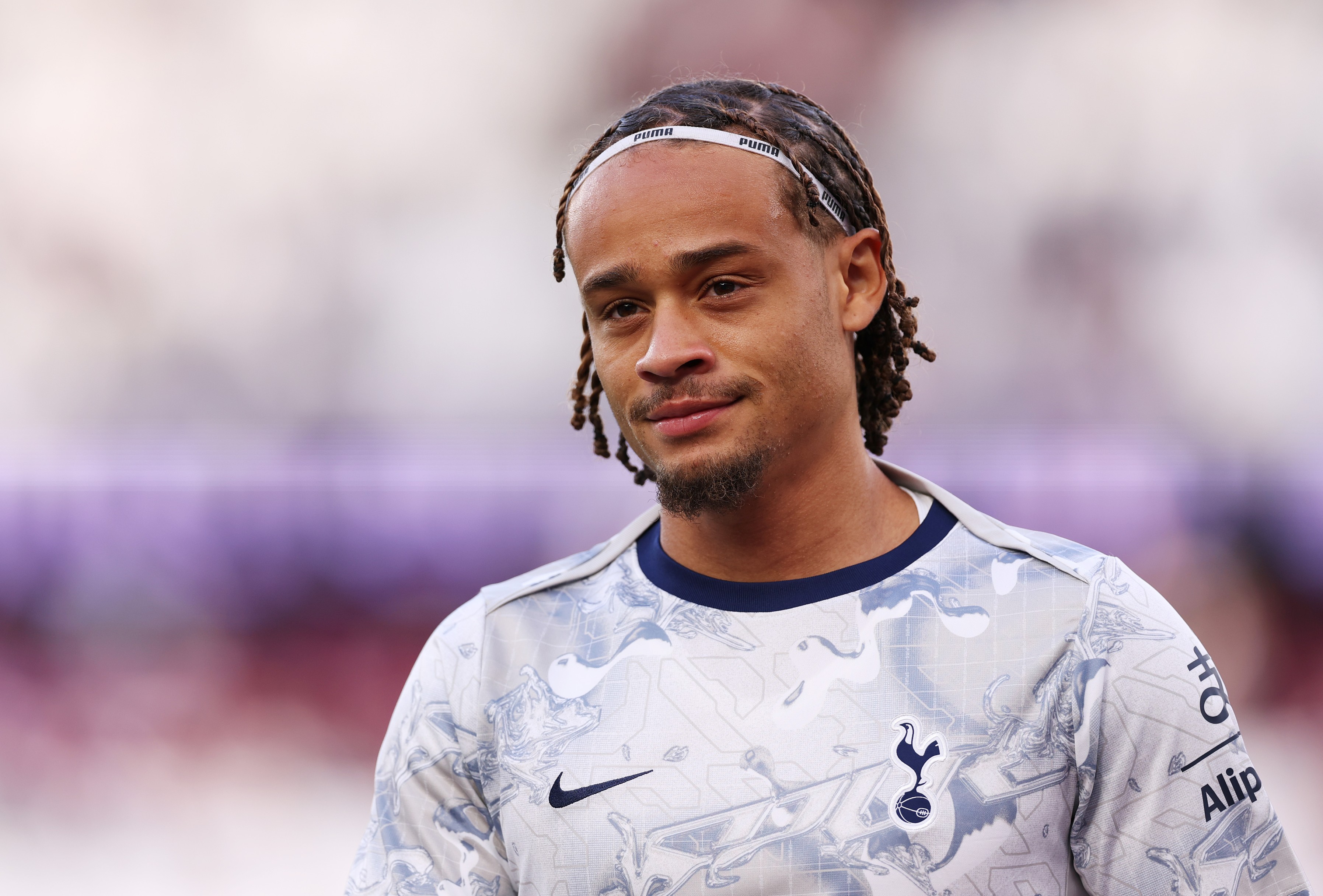 Xavi Simons of Tottenham Hotspur looks on