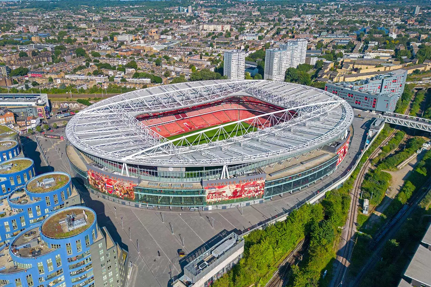 Aerial view of Emirates Stadium, home of Arsenal FC, with surrounding urban landscape.