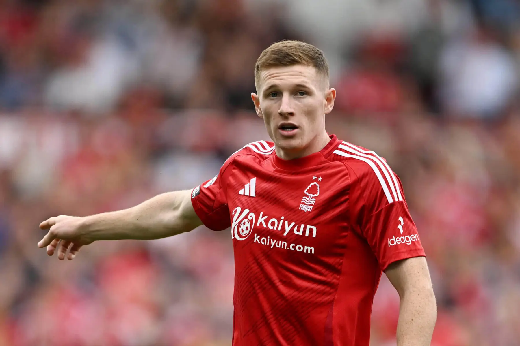Elliot Anderson wearing a red Nottingham Forest home kit during a match