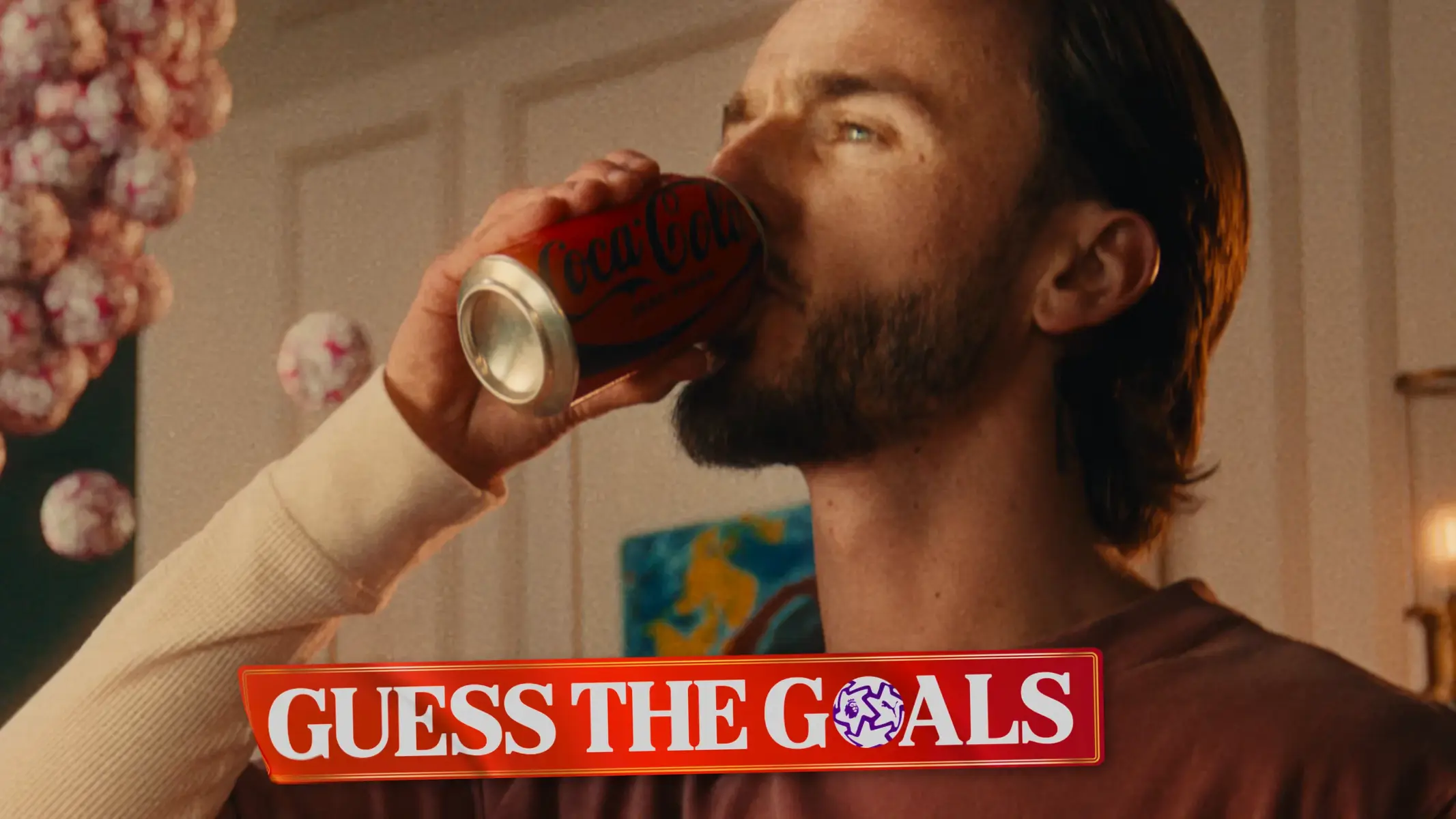 James Maddison drinking from a Coca-Cola can in a promotional video.
