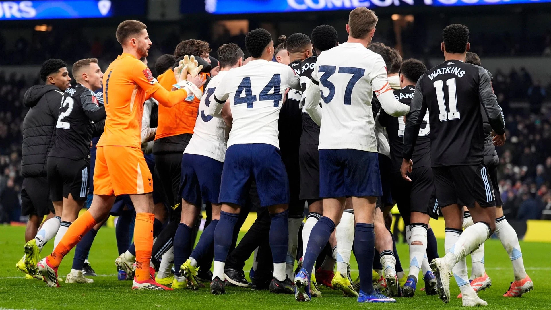 Football players from Tottenham Hotspur and Aston Villa in a confrontation during a match