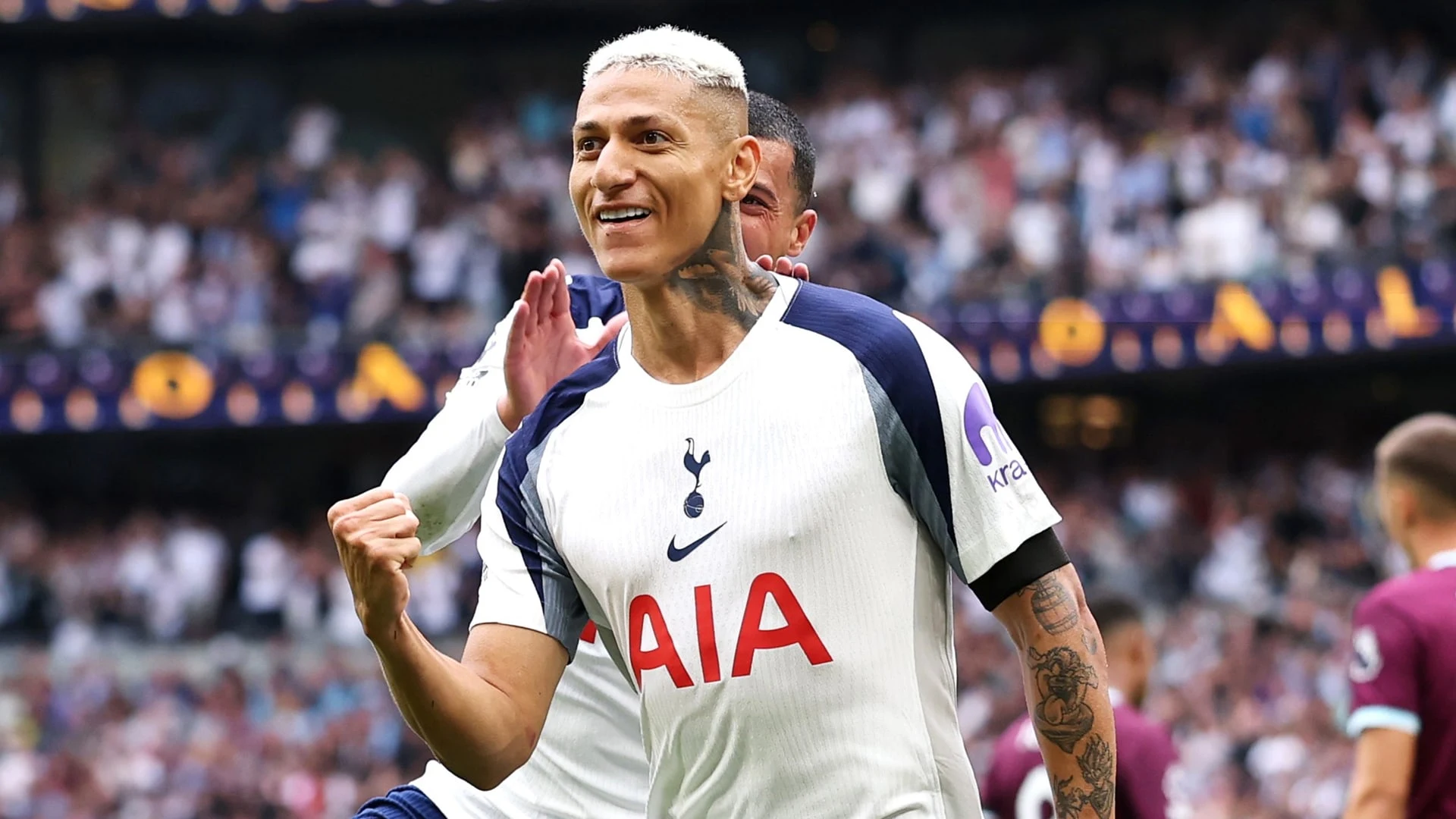 Richarlison celebrates in a Tottenham Hotspur kit during a match.